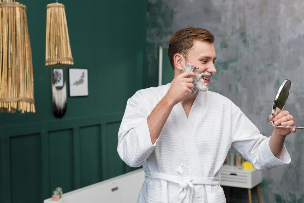Stylish man with neat hair and beard showcasing modern grooming standards
