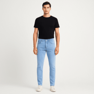 Man wearing light blue slim-fit jeans paired with black t-shirt and white sneakers – front full body view.