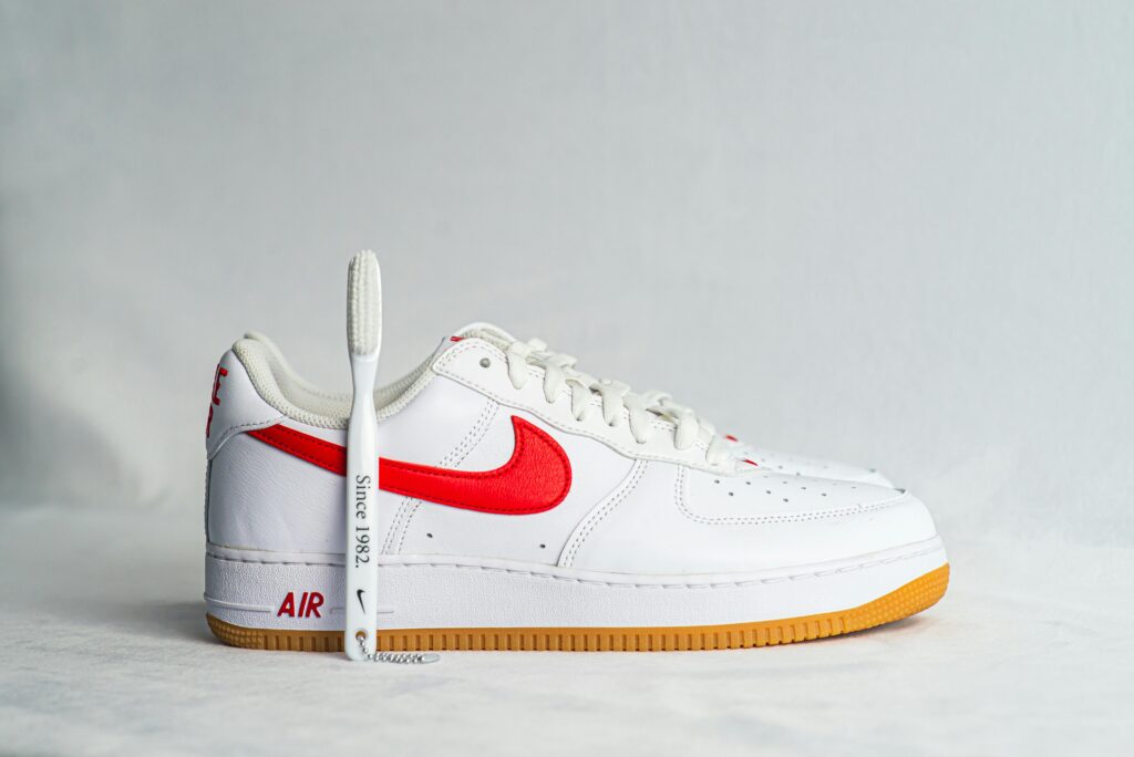 White sneaker in white Background and nike shoe